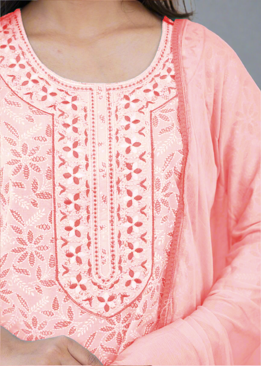 Close-up of a pink embroidered garment with intricate patterns.