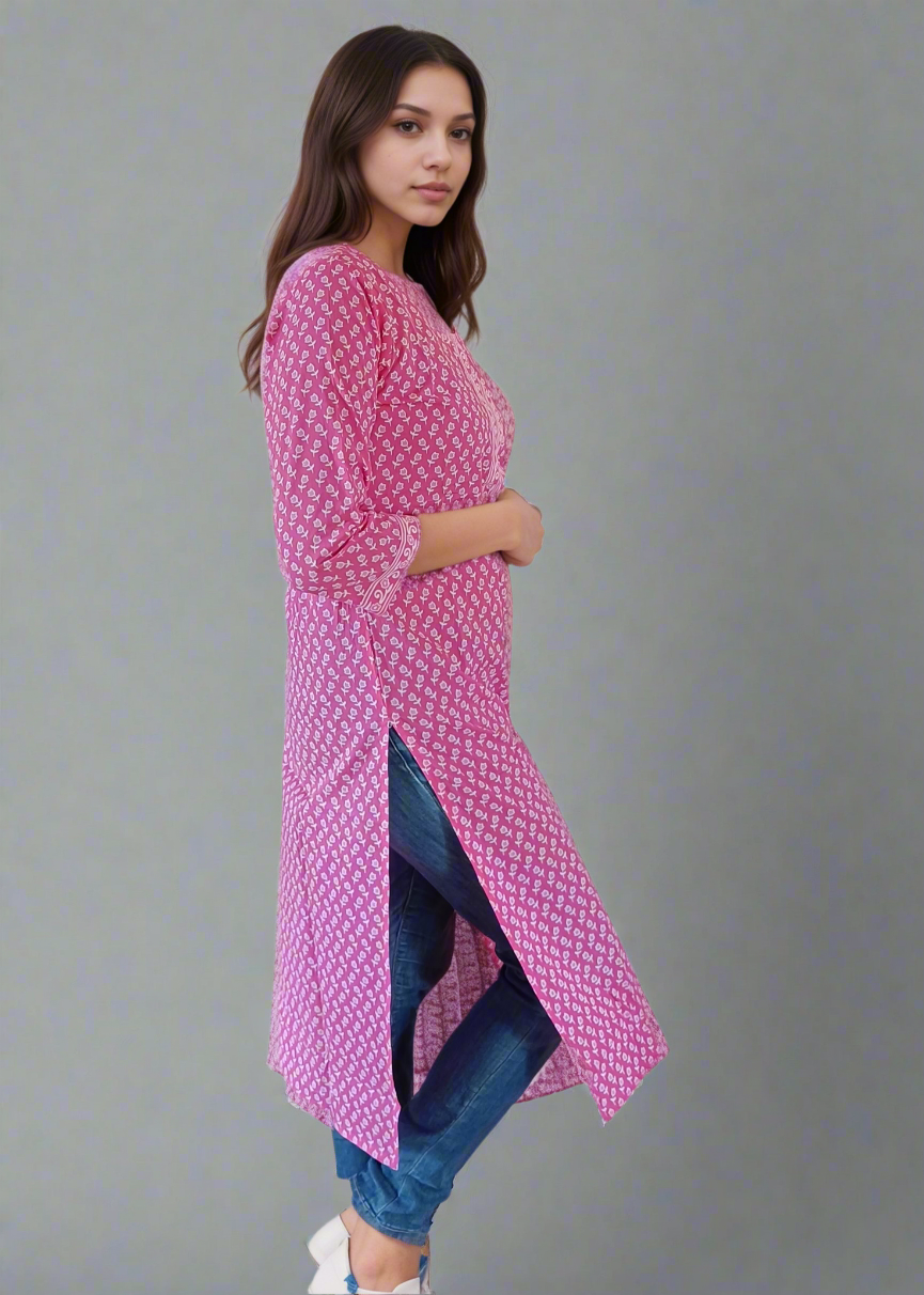 Woman wearing a pink side slit kurti on a white background
