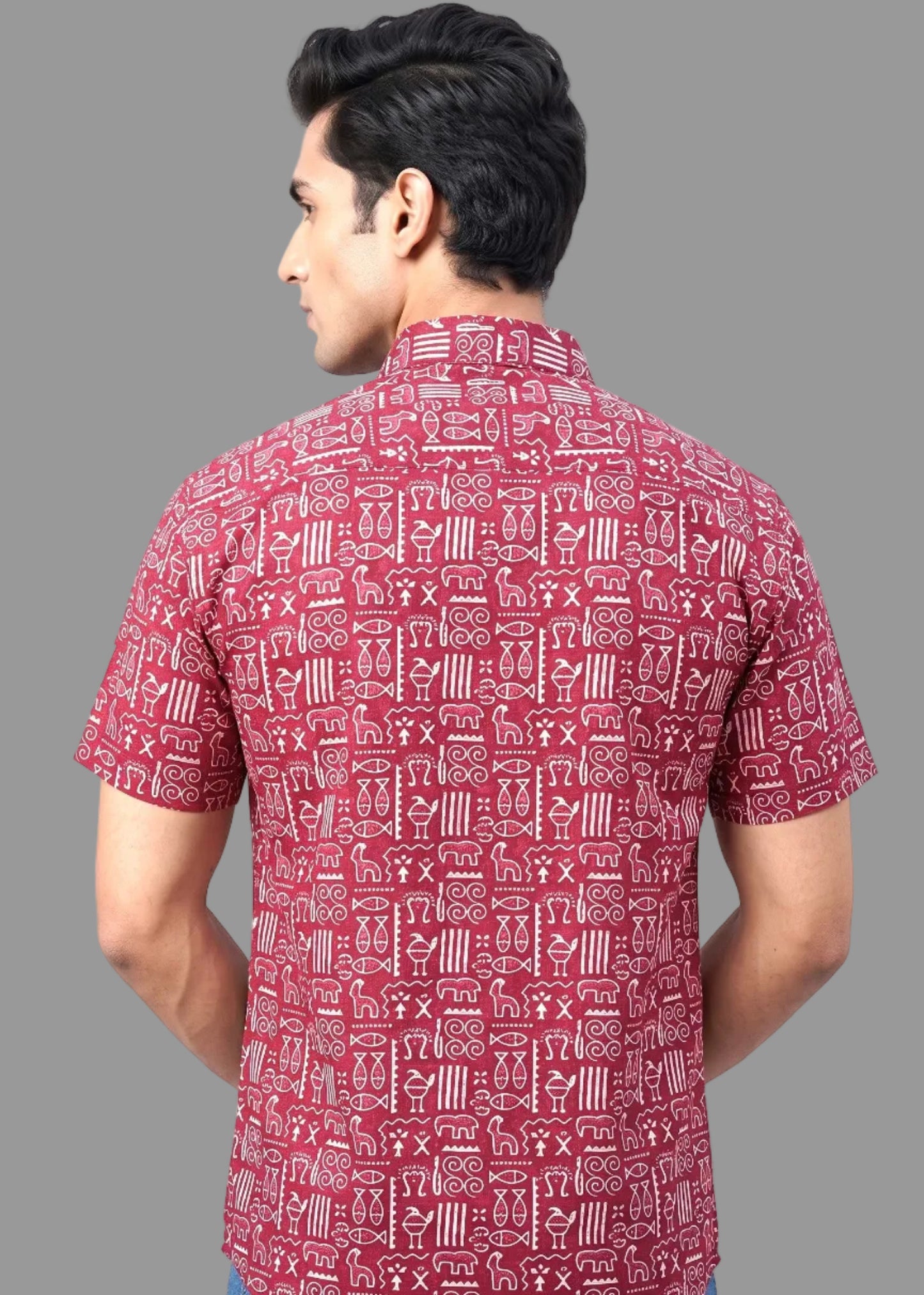 Man wearing a red patterned jaipuri shirt on a gray background