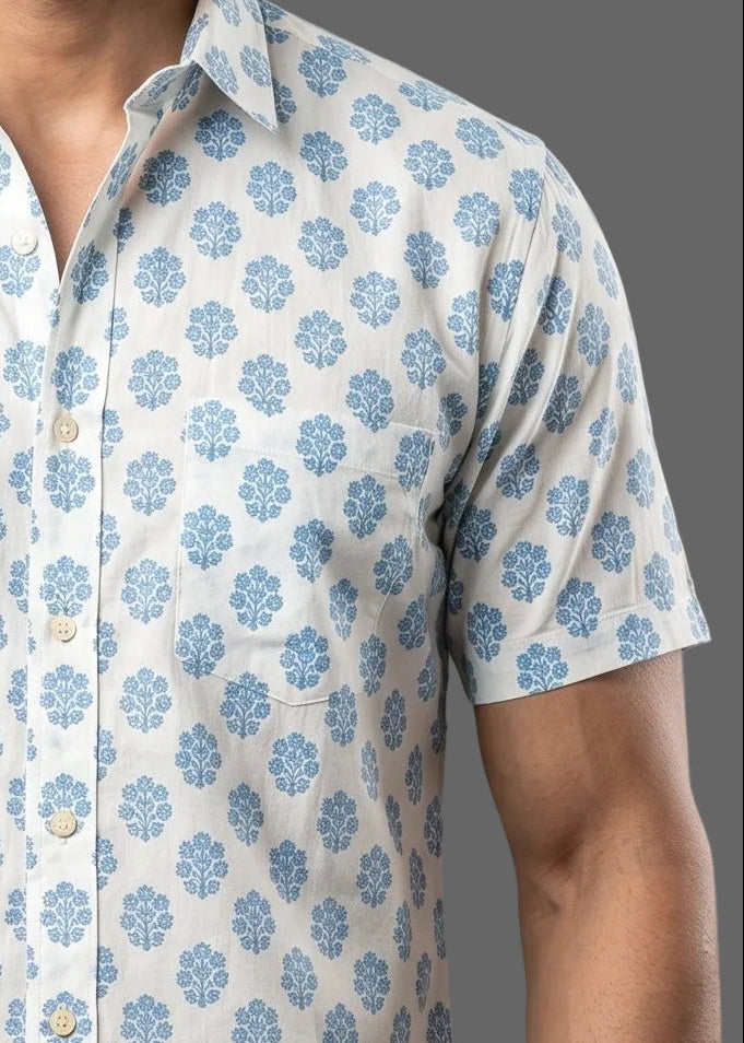 Short-sleeve shirt with blue floral pattern on a gray background