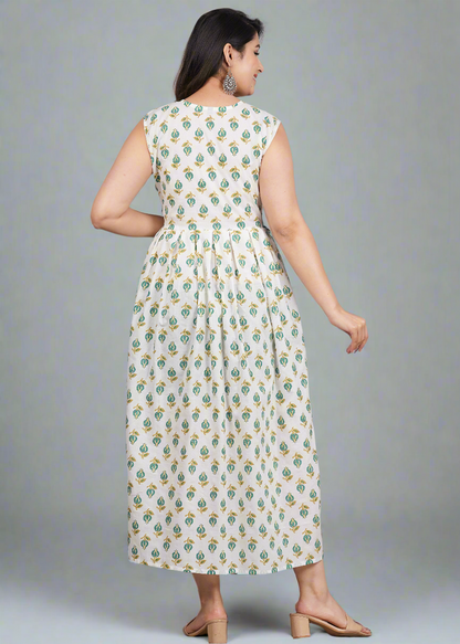Woman wearing a floral dress against a gray background