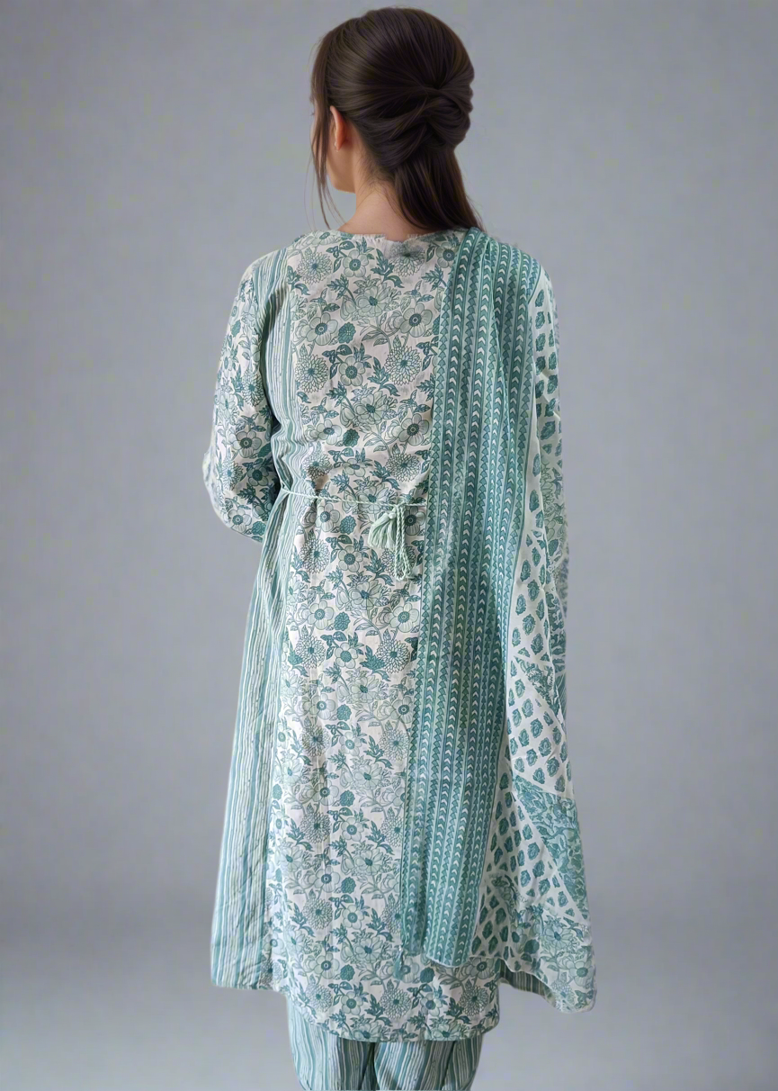 Woman wearing a floral suit set with a plain background