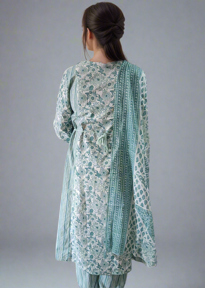 Woman wearing a floral suit set with a plain background