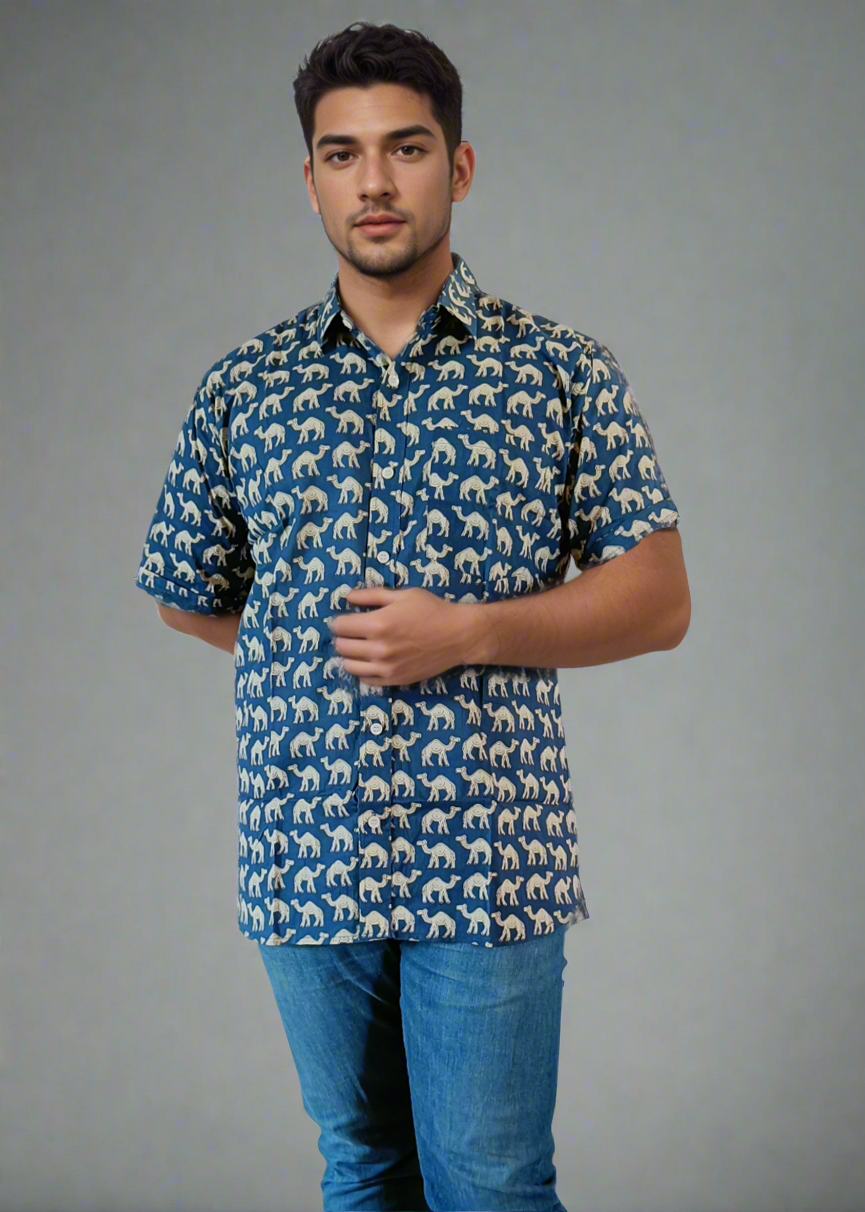 Man wearing a patterned shirt and blue jeans on a white background