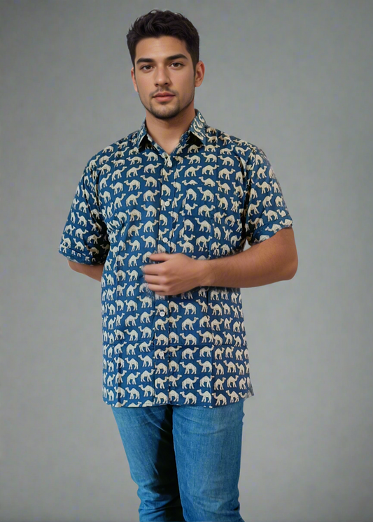 Man wearing a patterned shirt and blue jeans on a white background
