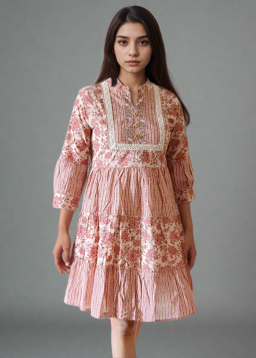 Woman wearing a floral stripe dress against a plain background