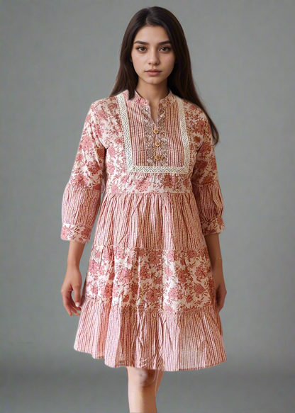Woman wearing a floral stripe dress against a plain background