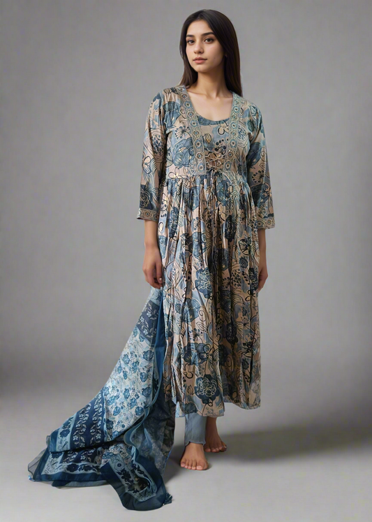 Woman wearing a long, patterned floral suit set dress on a white background