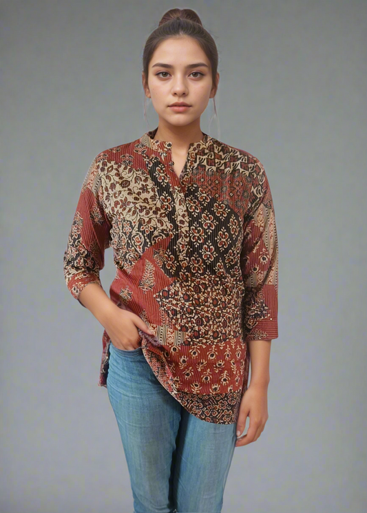 Woman wearing a patterned shirt and jeans on a white background