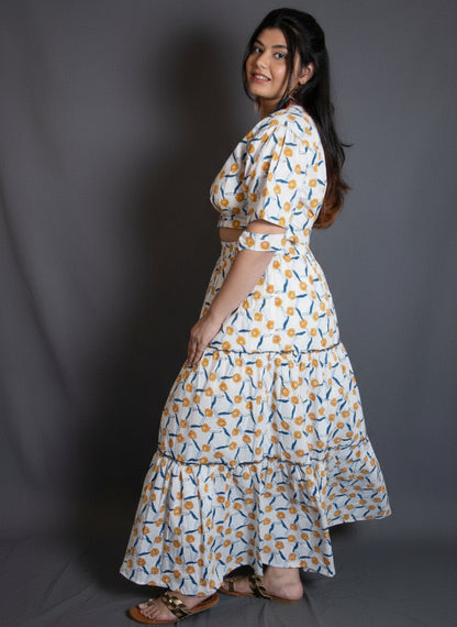 Woman in a patterned co-ord set of a blouse and a skirt