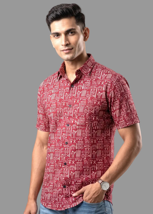 Man wearing a red patterned shirt on a gray background
