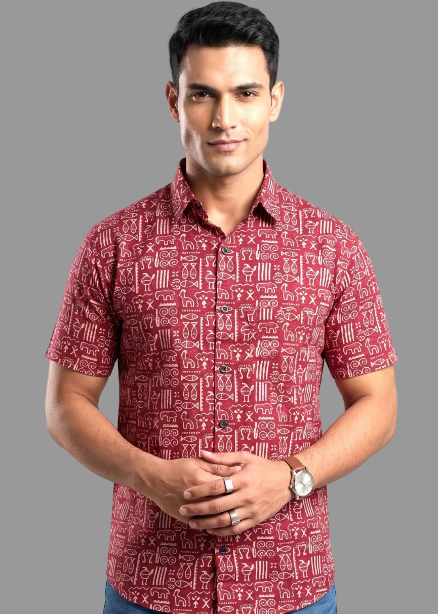 Man wearing a red patterned jaipuri shirt on a gray background