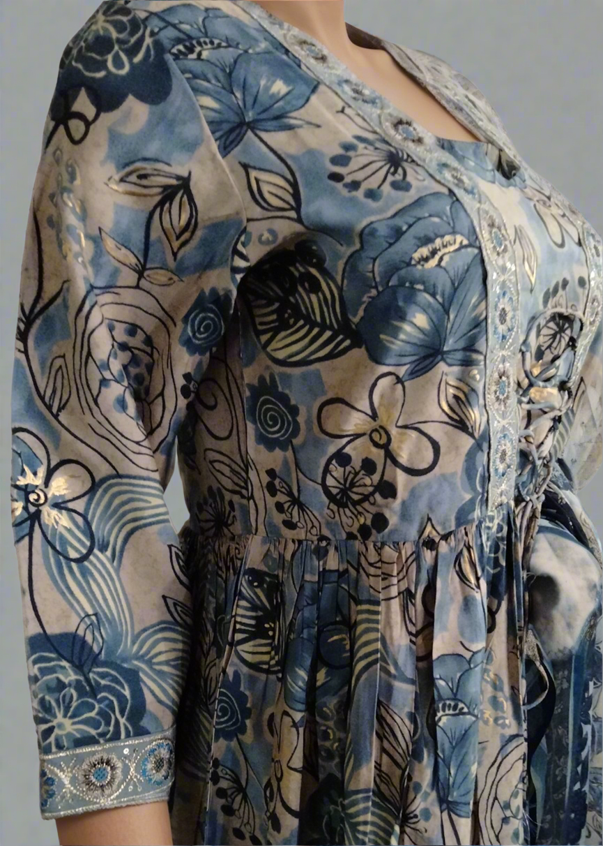 Blue floral patterned suit set dress with a plain background