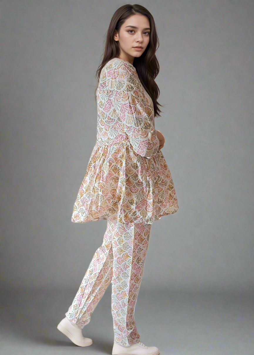 Woman wearing a floral outfit on a plain background