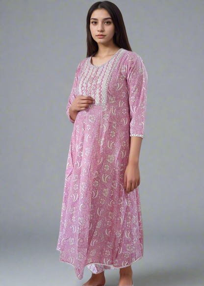 Woman wearing a pink floral dress with a white background